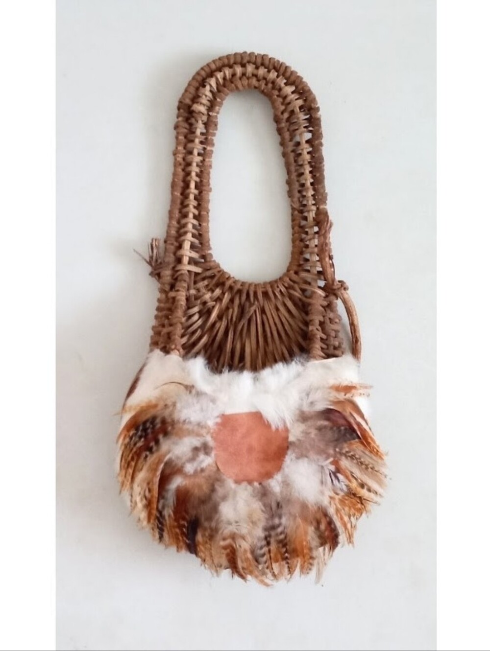Indigenous Native American vintage natural wicker and feather wall basket